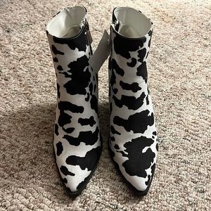 Pair of vintage cow print boots